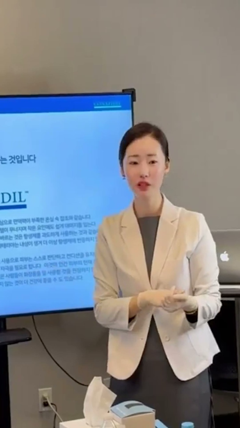 Pharmesthetic instructor teaching Superjection theory beside a slide on the Conapidil product line